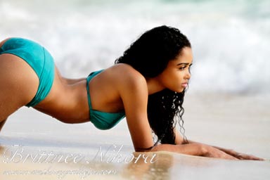 Hawaii Swimsuit Photographer - Swimsuit Model laying on the white sand of Waimanalo beach